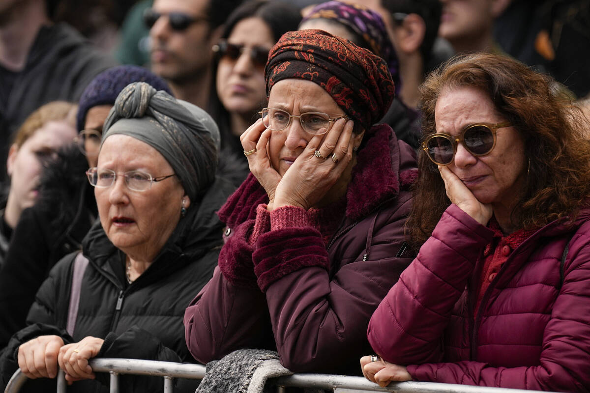 Mourners gather in grief around the grave of Israeli reserve solider Sergeant major Eliran Yege ...