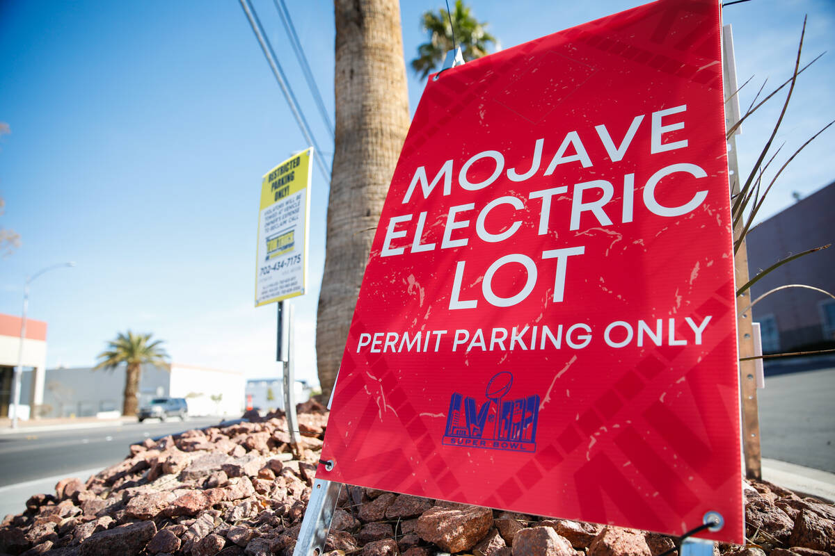 Businesses around Allegiant Stadium post signs restricting public parking as preparations conti ...