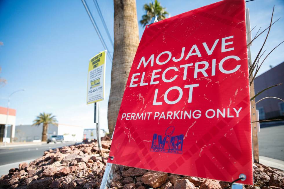 Businesses around Allegiant Stadium post signs restricting public parking as preparations conti ...