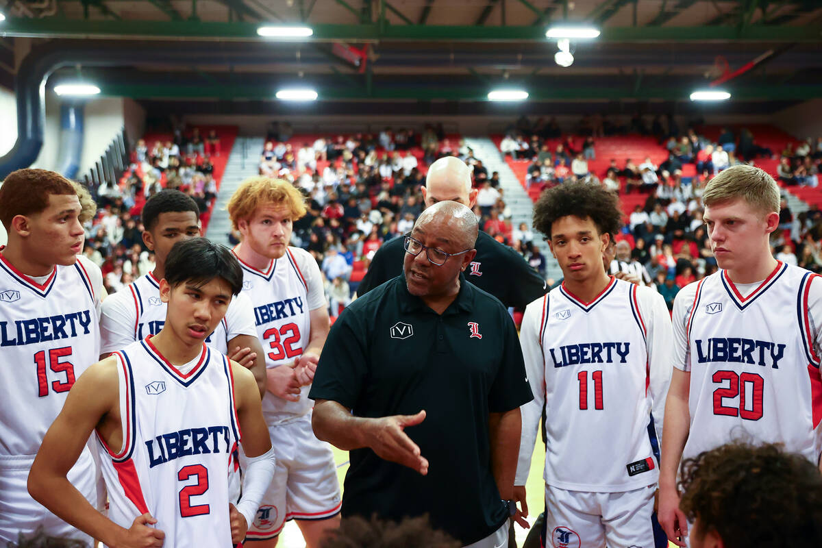 Liberty head coach Kevin Soares strategizes in a timeout during the second half of a high schoo ...