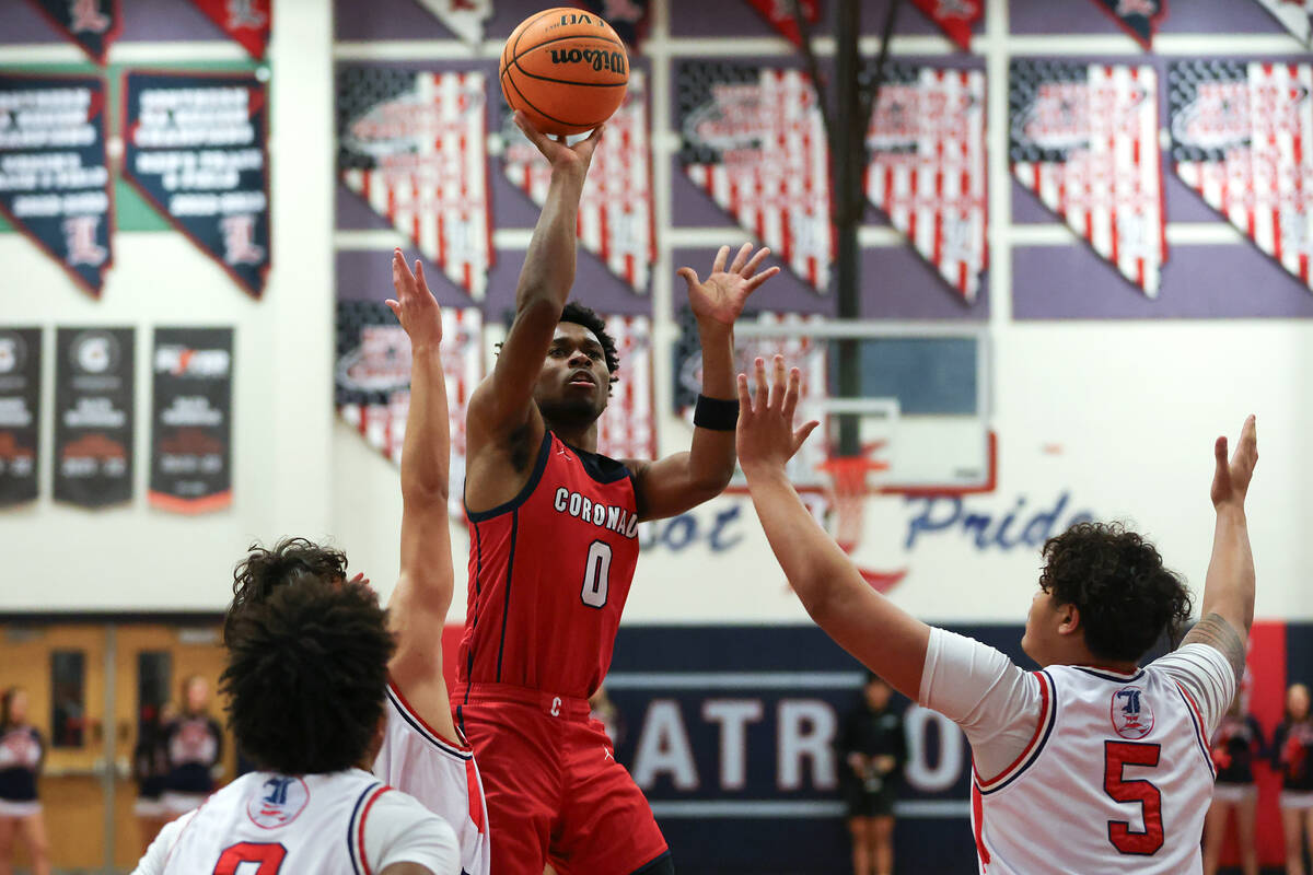Coronado guard Jonny Collins (0) shoots over Liberty forward Andre Porter (5) during the first ...