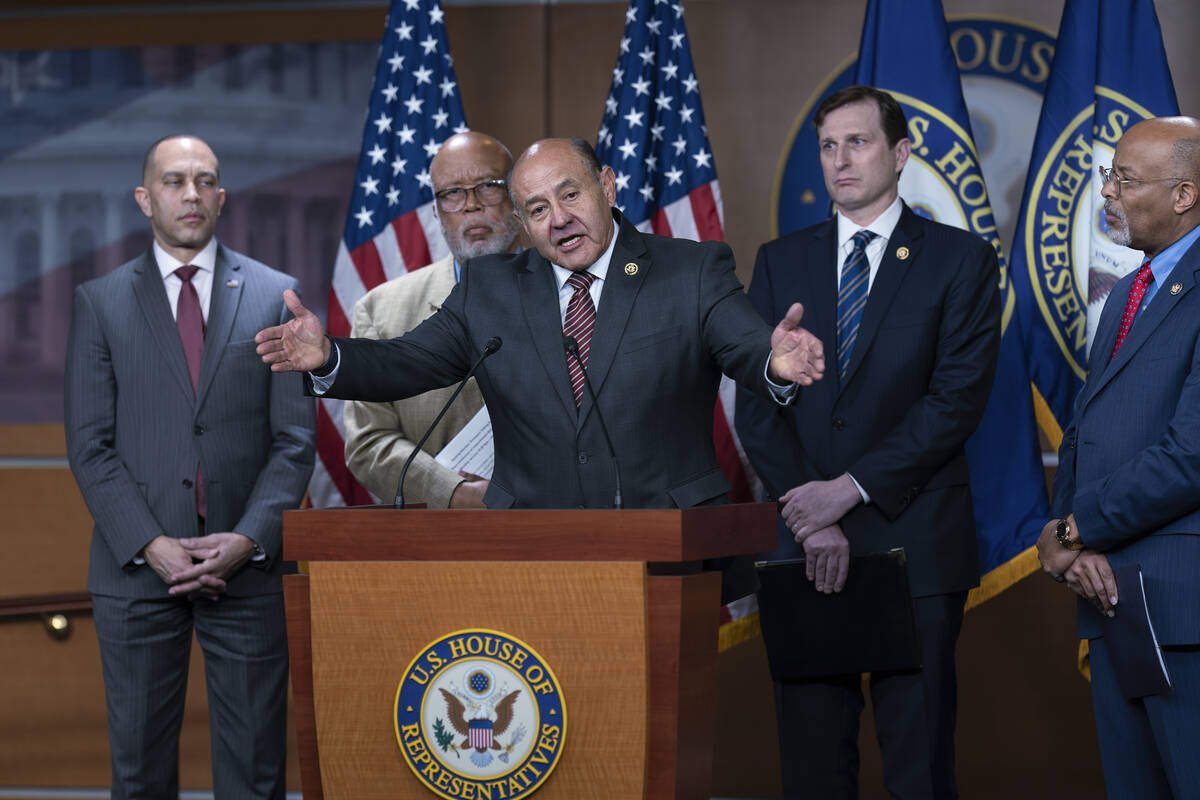 Rep. Lou Correa, D-Calif., speaks at center, joined from left by House Minority Leader Hakeem J ...