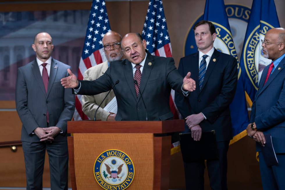 Rep. Lou Correa, D-Calif., speaks at center, joined from left by House Minority Leader Hakeem J ...