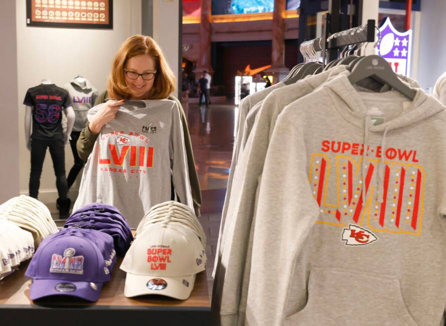 Jean Ziak of Chicago, a Kansas City Chiefs fan, checks out Super Bowl LVIII merchandise at the ...