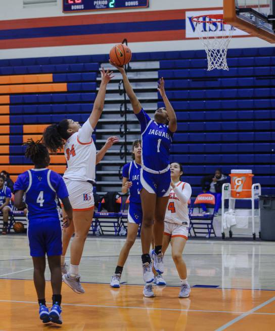 Desert Pines’ Siara Bracey (1) tries to block Bishop Gorman’s Aliitasi Fakatoumaf ...