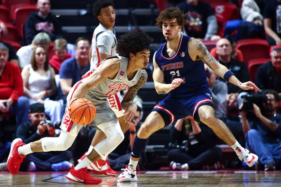 UNLV Rebels guard Brooklyn Hicks (13) drives toward the hoop against Fresno State Bulldogs guar ...