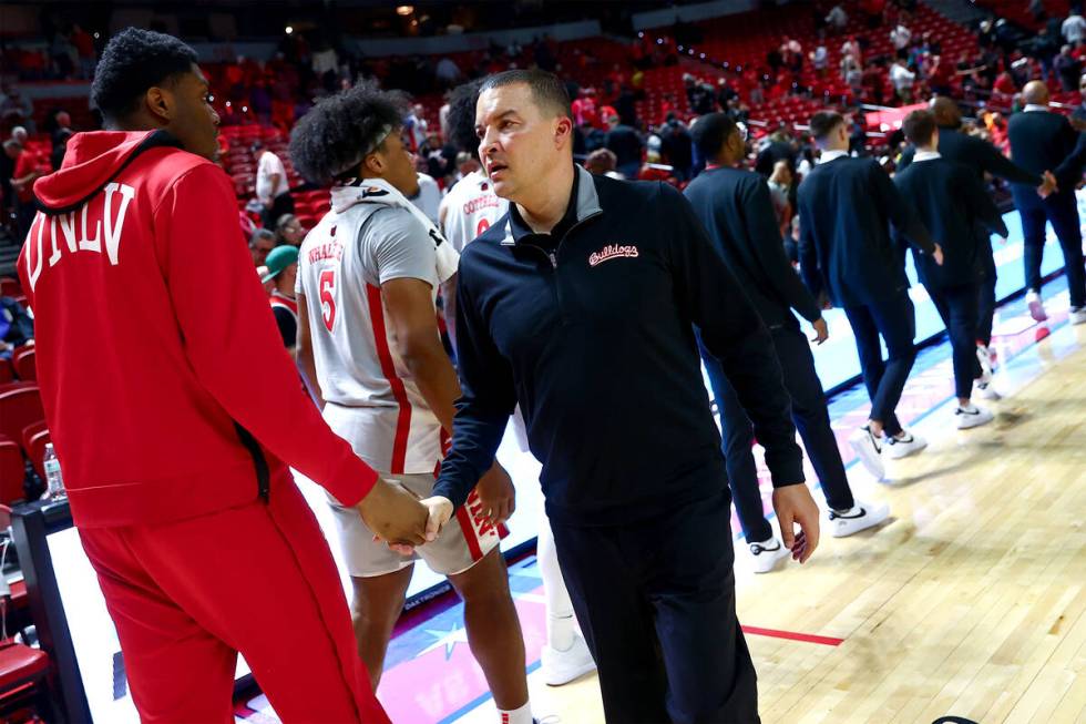 Fresno State Bulldogs head coach Justin Hutson congratulates the UNLV Rebels on their win in an ...