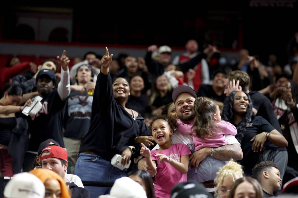 UNLV Rebels fans dance to the music during the second half of an NCAA college basketball game a ...