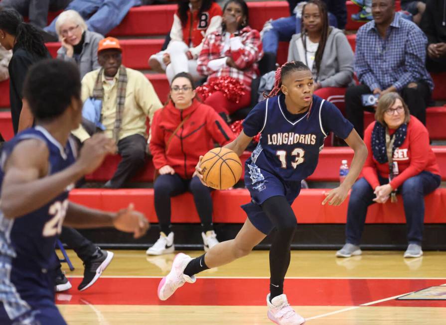 Legacy's Rahjon Chambers (13) brings the ball up court during the second half a basketball game ...