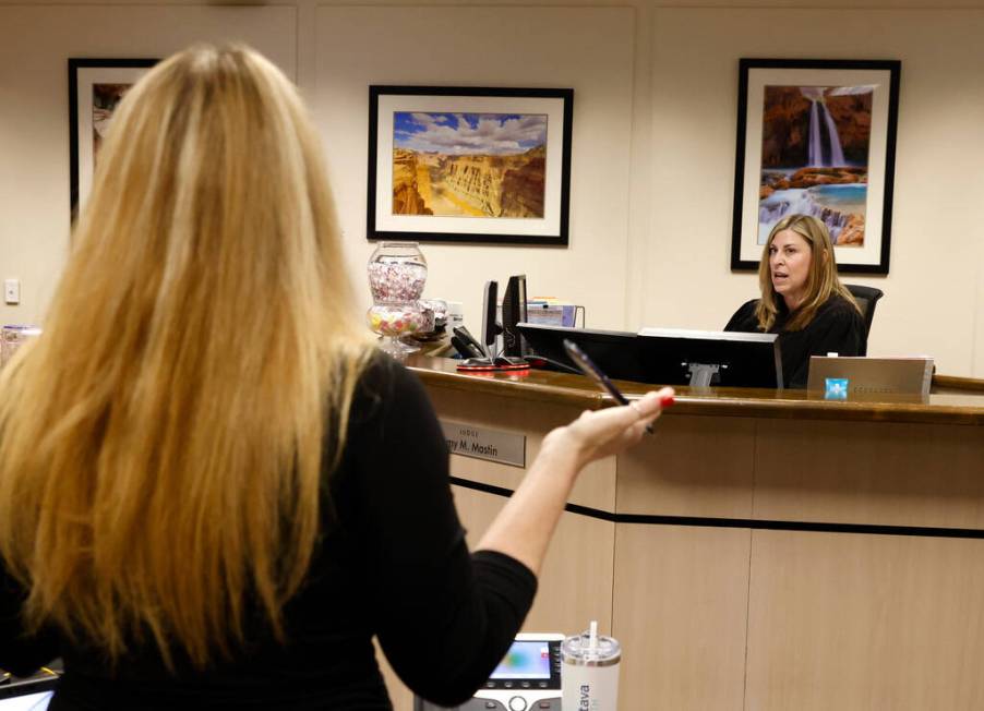 Clark County Family Court Judge Amy Mastin, right, listens to Summer Clarke, a prosecutor, duri ...