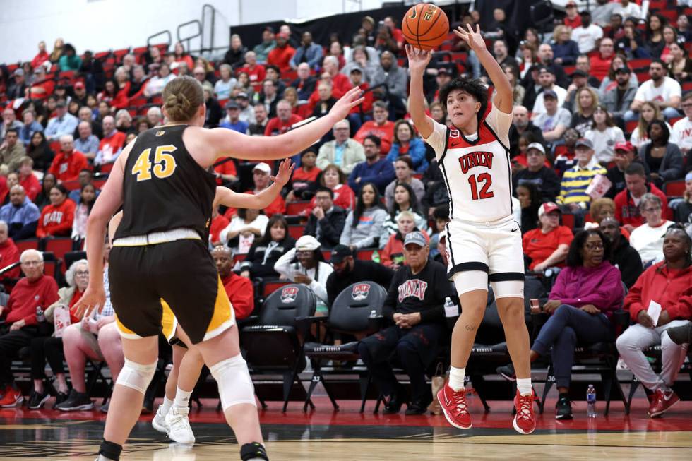 UNLV Lady Rebels guard Alyssa Durazo-Frescas (12) shoots a three-pointer while Wyoming Cowgirls ...