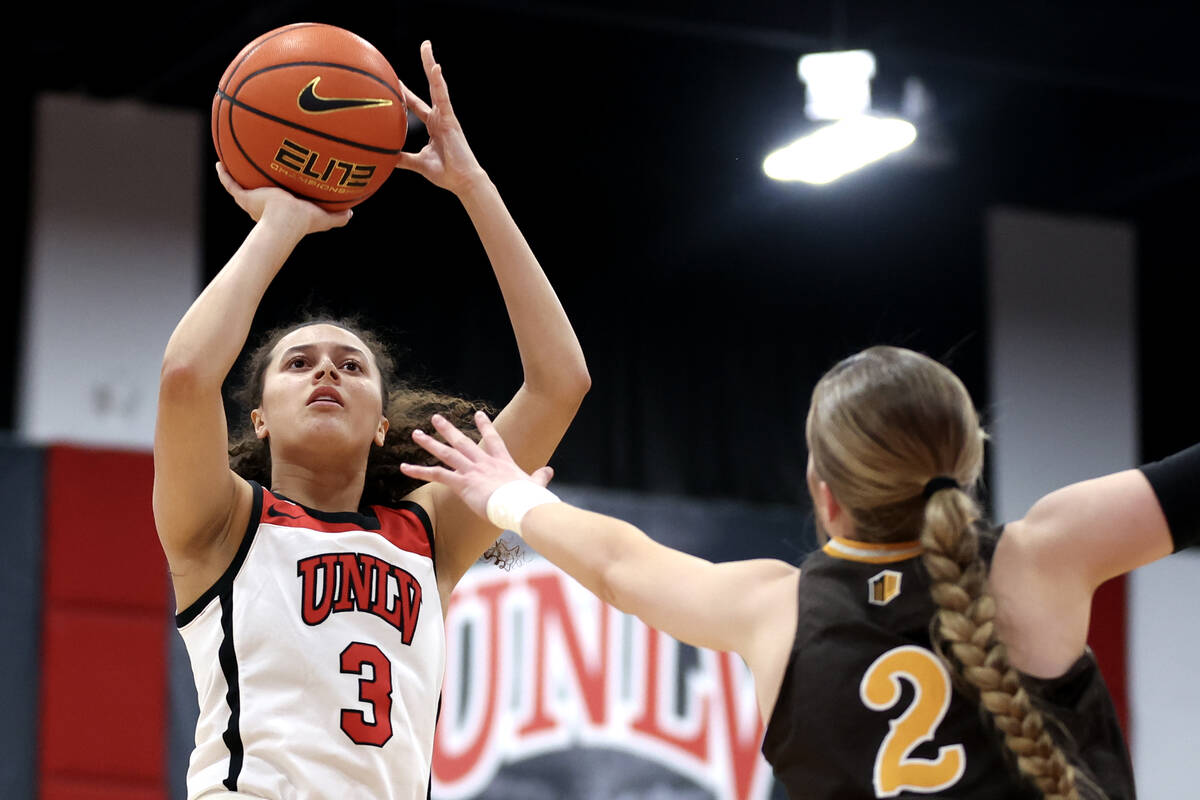 UNLV Lady Rebels guard Kiara Jackson (3) shoots against Wyoming Cowgirls guard Emily Mellema (2 ...