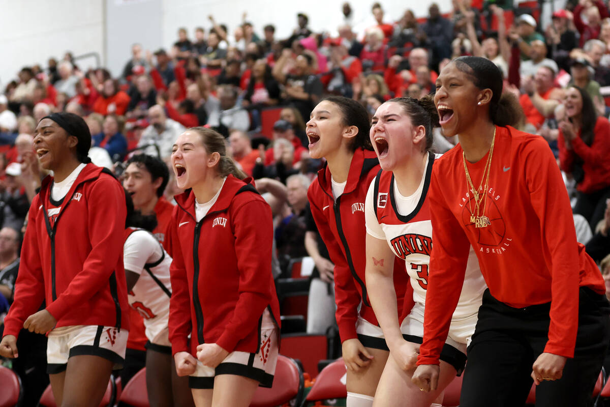 The UNLV Lady Rebels bench cheers for their team during the second half of an NCAA college bask ...