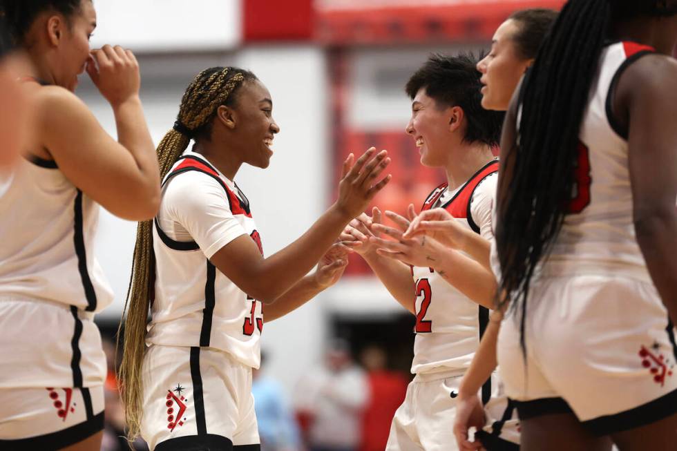 UNLV Lady Rebels guards Amarachi Kimpson (33) and Alyssa Durazo-Frescas (12) celebrate during t ...