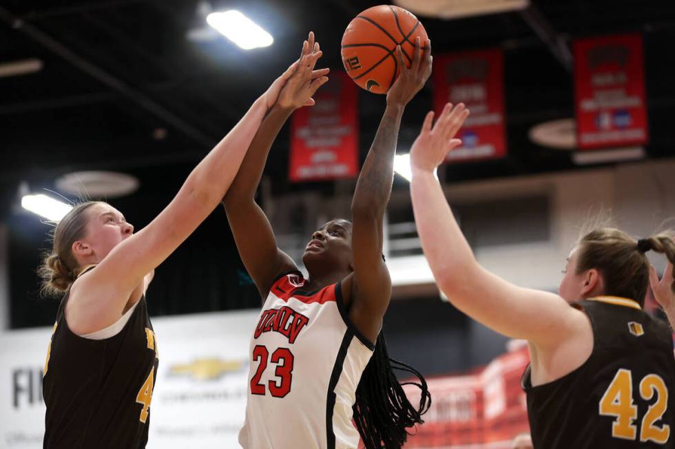 UNLV Lady Rebels center Desi-Rae Young (23) shoots against Wyoming Cowgirls center Allyson Fert ...