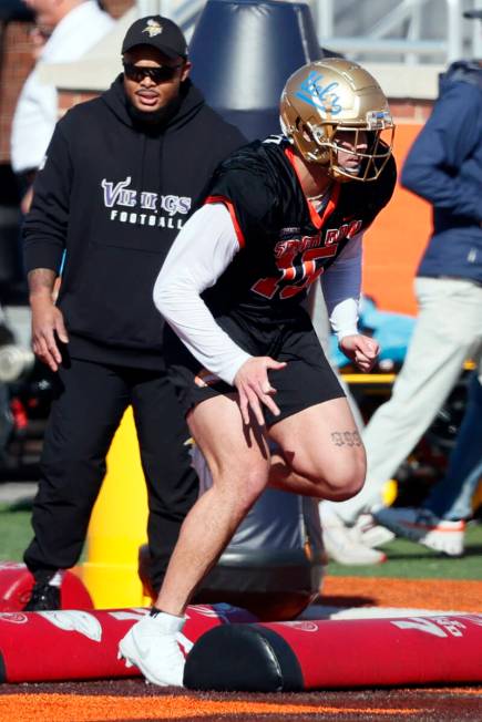 National edge Laiatu Latu of Ucla runs through drills during practice for the Senior Bowl NCAA ...