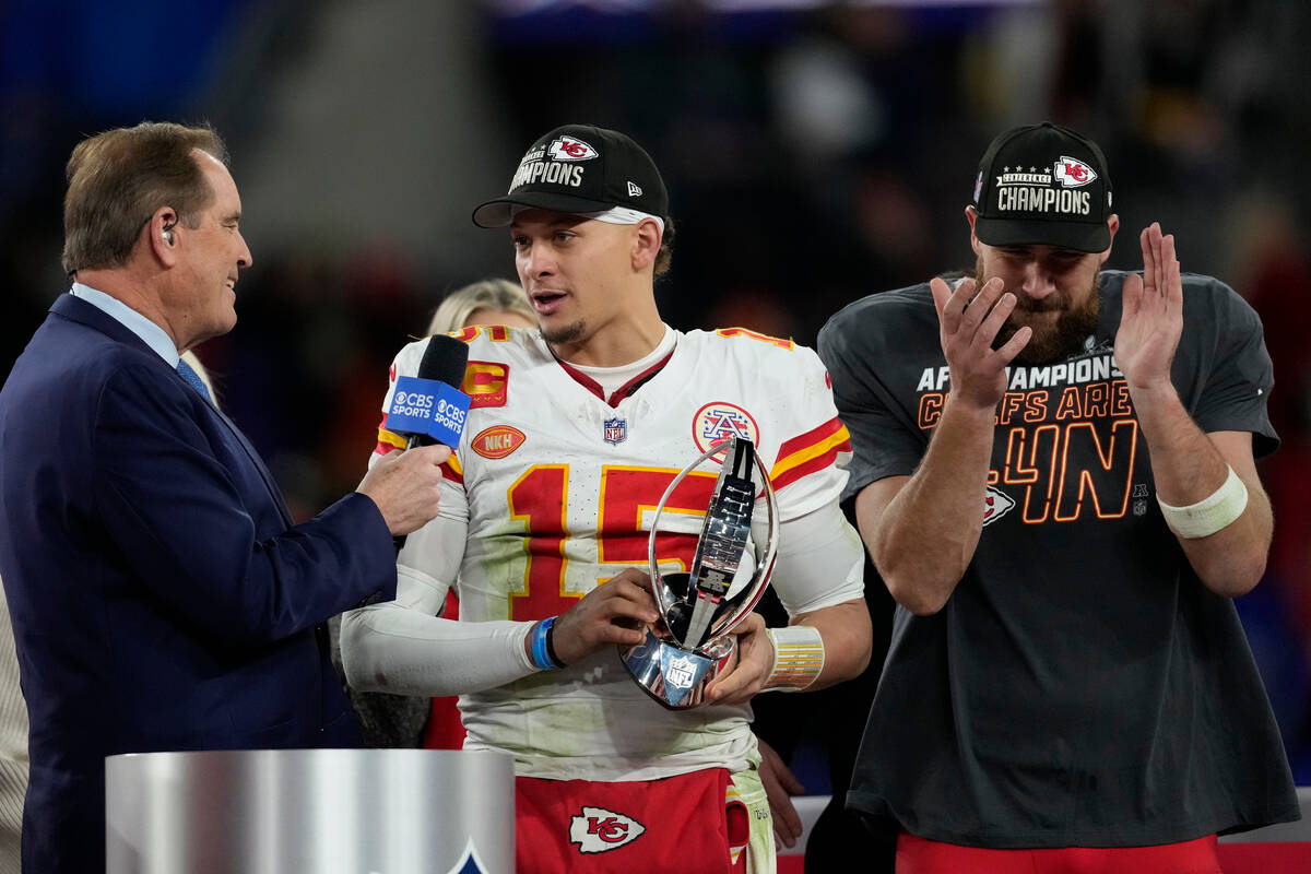 Kansas City Chiefs quarterback Patrick Mahomes (15) holds up the Lamar Hunt Trophy after the AF ...