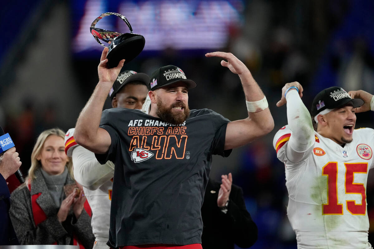 Kansas City Chiefs tight end Travis Kelce holds the Lamar Hunt trophy after an AFC Championship ...