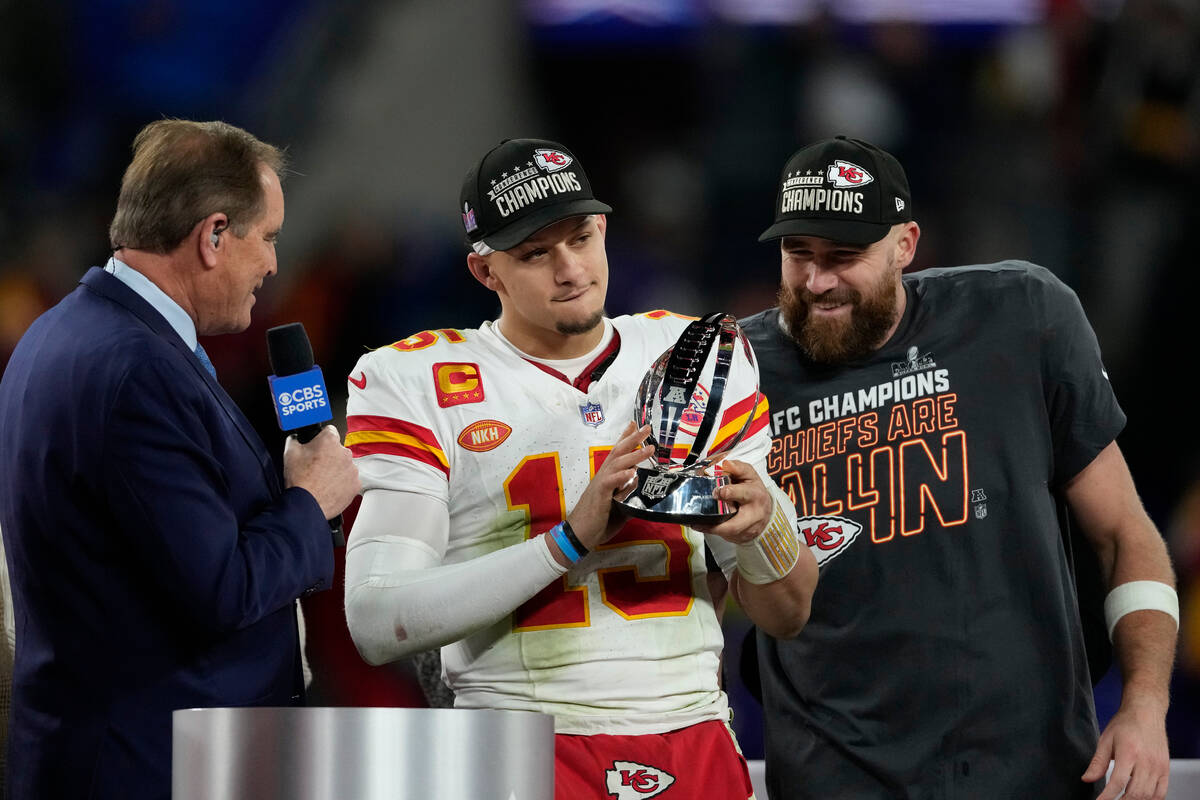 Kansas City Chiefs quarterback Patrick Mahomes (15) holds up the Lamar Hunt Trophy after the AF ...