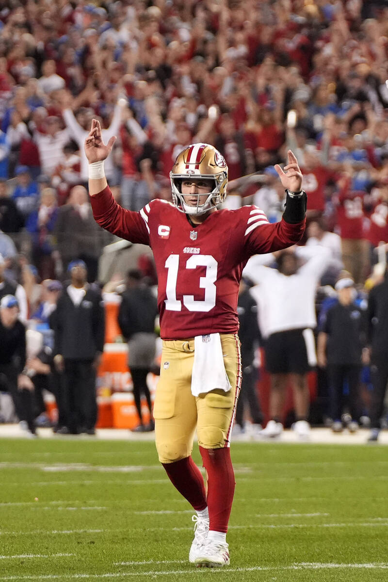 San Francisco 49ers quarterback Brock Purdy (13) celebrates after a touchdown run by Elijah Mit ...