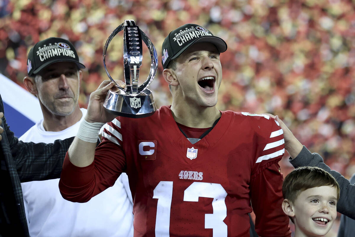 San Francisco 49ers quarterback Brock Purdy (13) and head coach Kyle Shanahan, left, celebrate ...