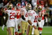 San Francisco 49ers quarterback Jimmy Garoppolo walks to the sideline during the second half of ...