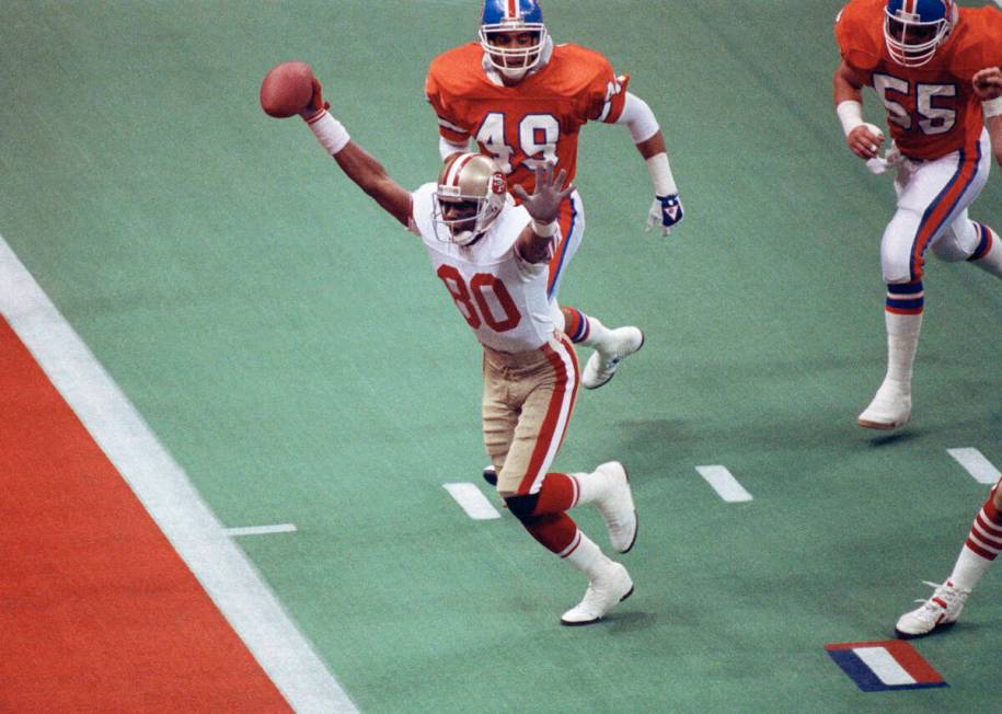 FILE - In this Jan. 28, 1990, file photo, San Francisco 49ers wide receiver Jerry Rice celebrat ...