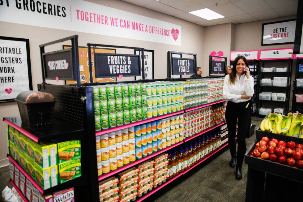 Brooke Neubauer, founder and CEO of the Just One Project, walks around the grand opening of the ...