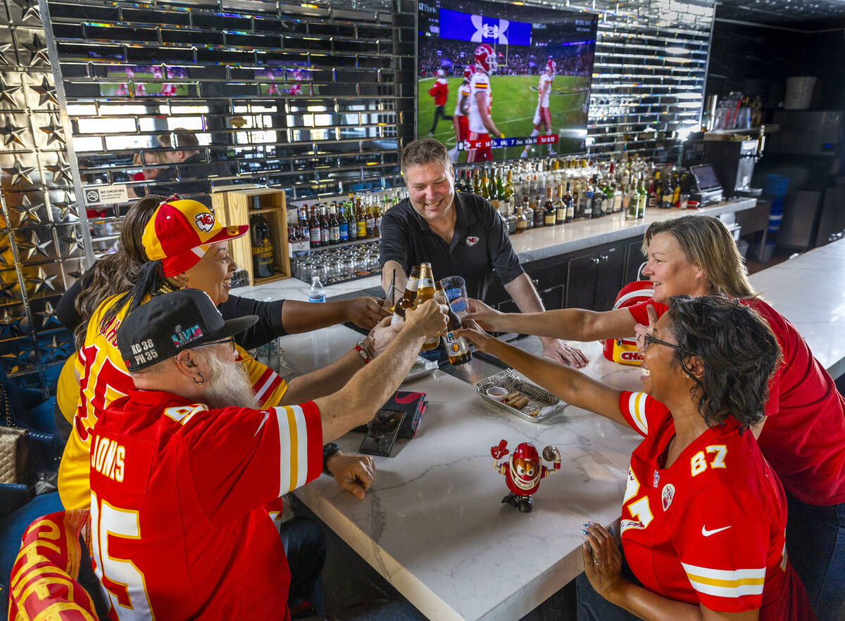 The Jackpot Bar owner Jeff Frederick, facing, toasts with members of the KC CHIEFS - Las Vegas ...