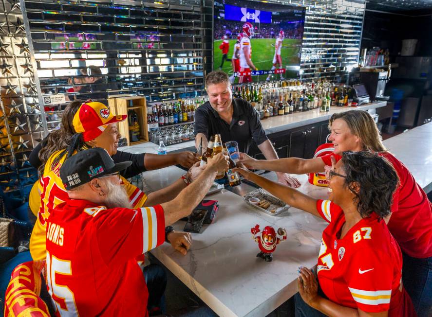 The Jackpot Bar owner Jeff Frederick, facing, toasts with members of the KC CHIEFS - Las Vegas ...