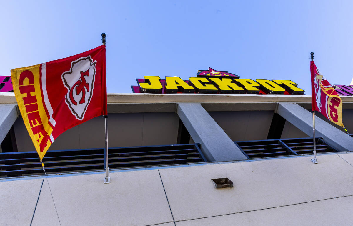 Kansas City Chiefs flags hang outside the Jackpot Bar which features members of the KC CHIEFS - ...