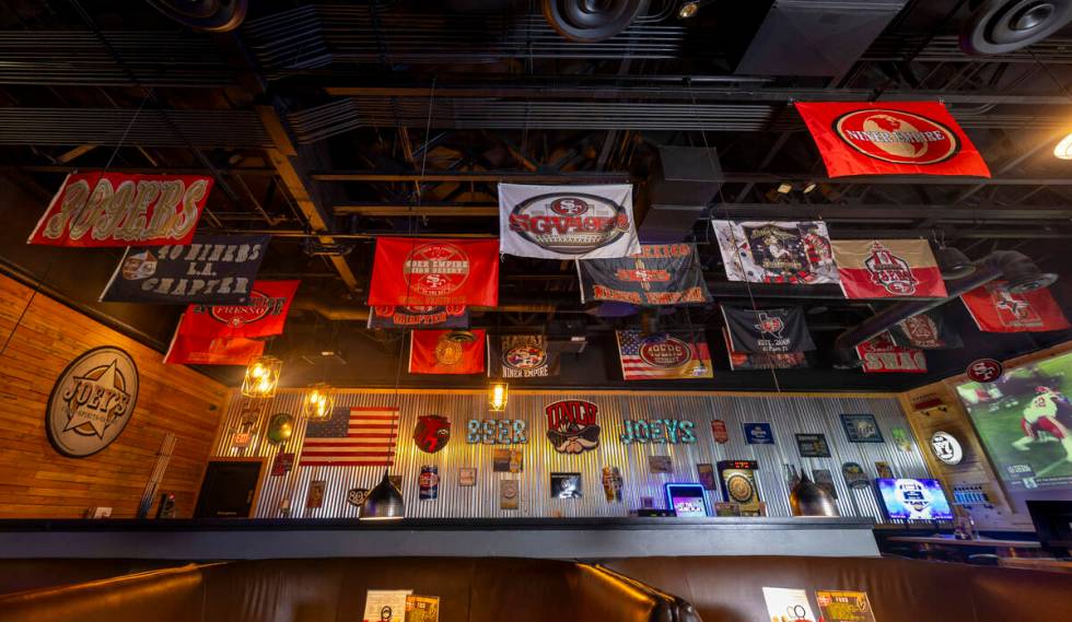 Lots of San Francisco 49ers club banners hang from the rafters at Joey's Tavern where they are ...