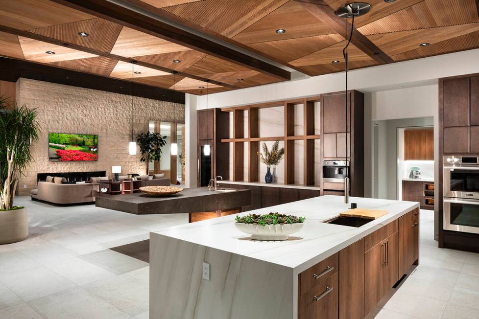 The voluminous open-concept floor plan seamlessly integrates formal living, dining, gourmet kit ...