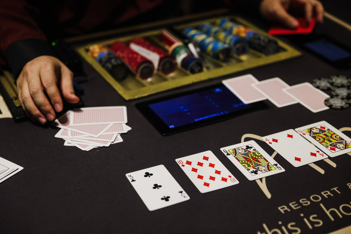 A dealer deals poker at the Aria hotel-casino in Las Vegas, Wednesday, Jan. 31, 2024. (Rachel A ...
