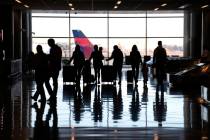 FILE - People pass through Salt Lake City International Airport Wednesday, Jan. 11, 2023, in Sa ...