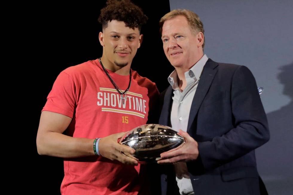 FILE - In this Feb. 3, 2020, file photo, Kansas City Chiefs quarterback Patrick Mahomes, left, ...