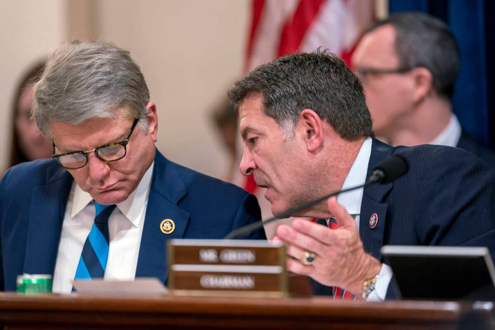 Chairman Mark Green, R-Tenn., right, confers with Rep. Michael McCaul, R-Texas, left, as Republ ...