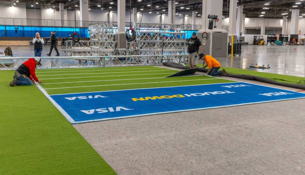 A small indoor field is installed as set up continues for the Super Bowl Experience at the Mand ...