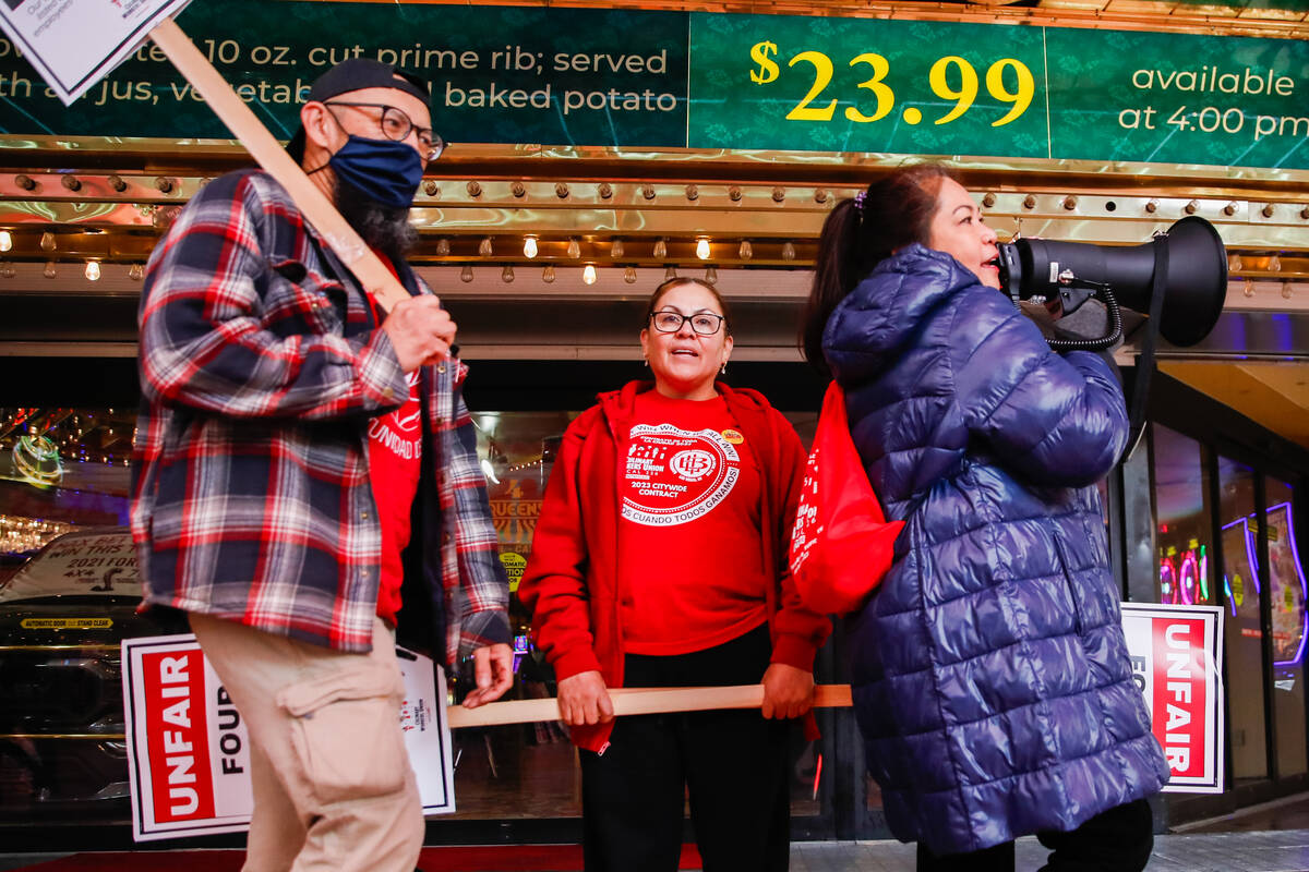 Members of the Culinary Local 226 picket outside the Four Queens Hotel & Casino on Friday, Feb. ...