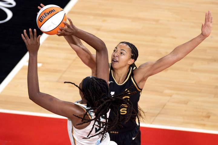 Las Vegas Aces center Kiah Stokes (41) attempts to block a shot by New York Liberty forward Jon ...