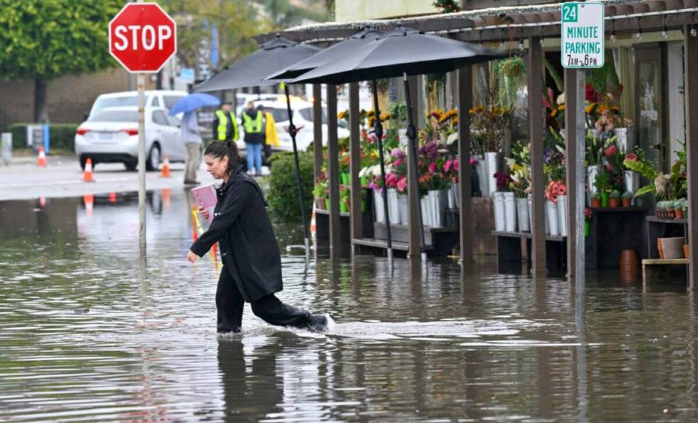 Mandy Garrett walks across Marina Drive as she leaves Devynn's Garden, just south of Pacific Co ...