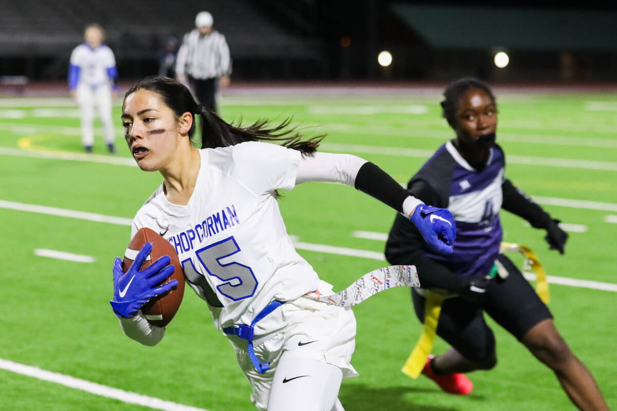 Bishop Gorman’s Alana Moore (15) charges down the field during a flag football game betw ...