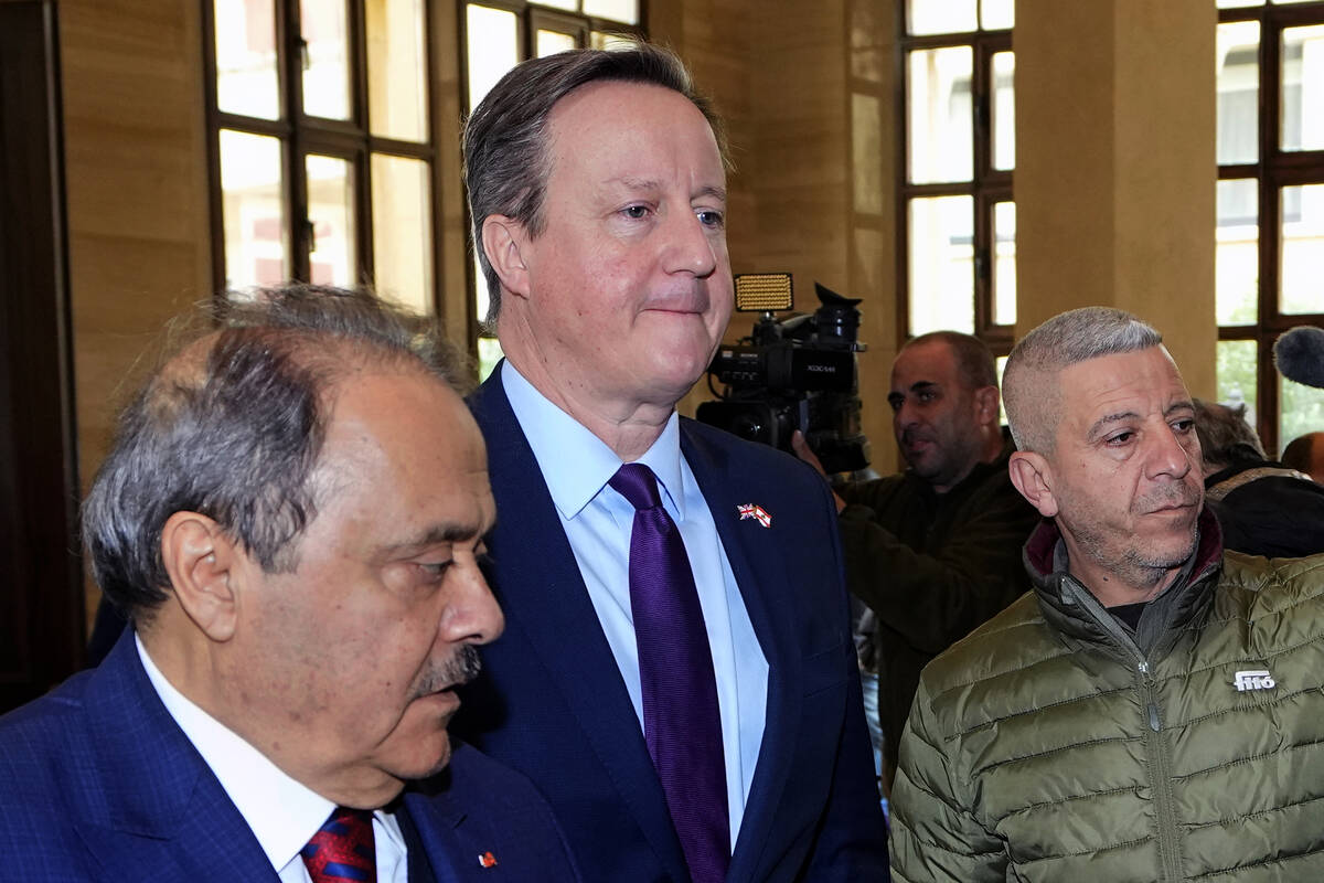 Britain's Foreign Secretary David Cameron, center, arrives to meet Lebanese Parliament Speaker ...