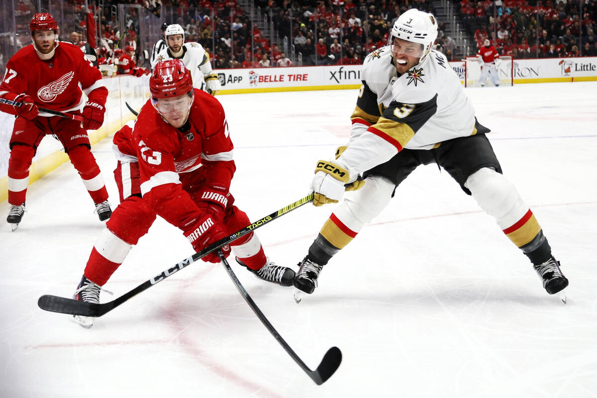 Vegas Golden Knights defenseman Brayden McNabb (3) hits the hand of Detroit Red Wings left wing ...