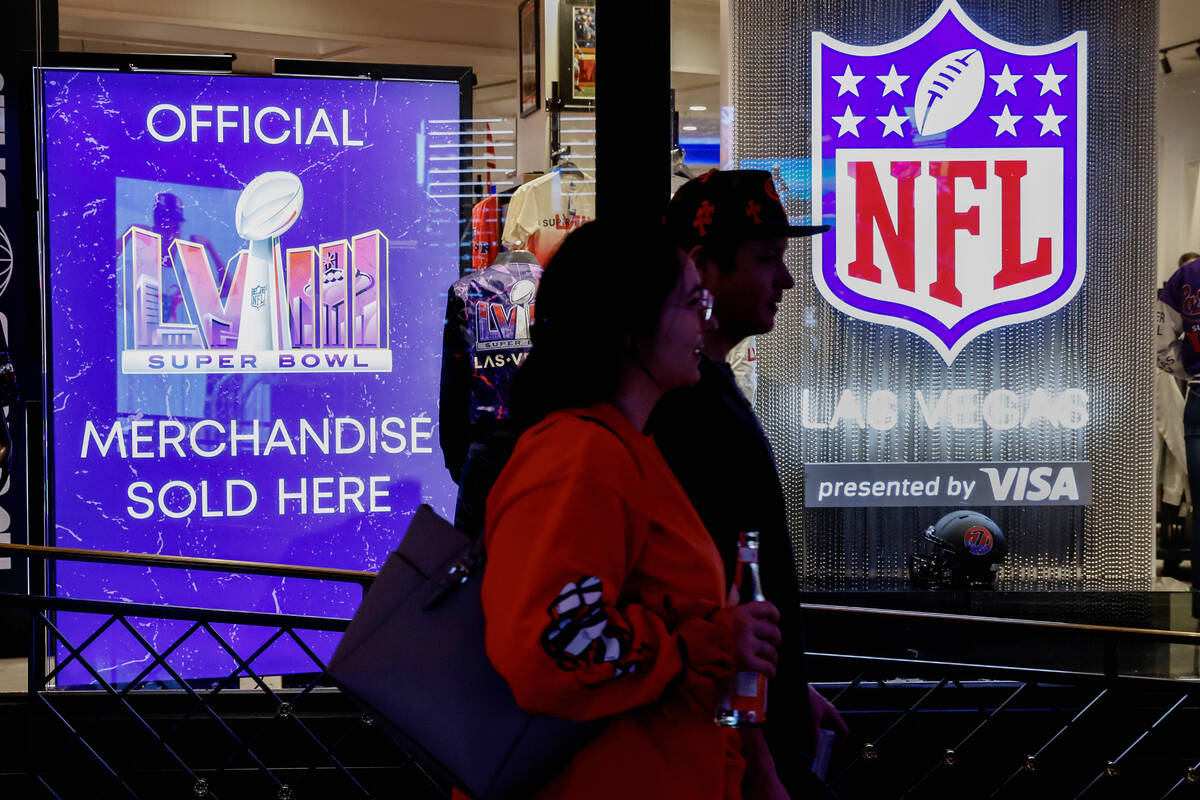 Shoppers walk past the NFL Las Vegas store at the Forum Shop, on Tuesday, Jan. 30, 2024, in Las ...