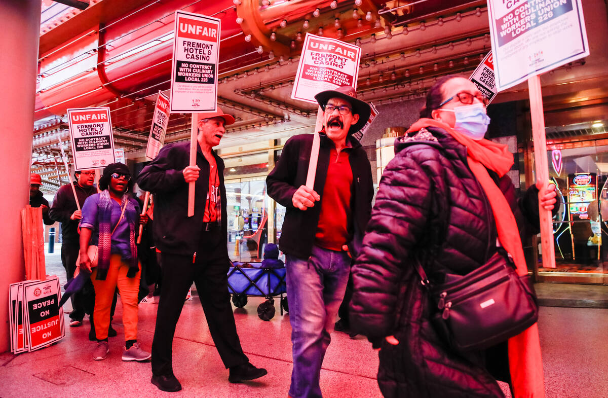 Members of the Culinary Union picket outside of Fremont Hotel & Casino on Friday, Feb. 2, 2024 ...