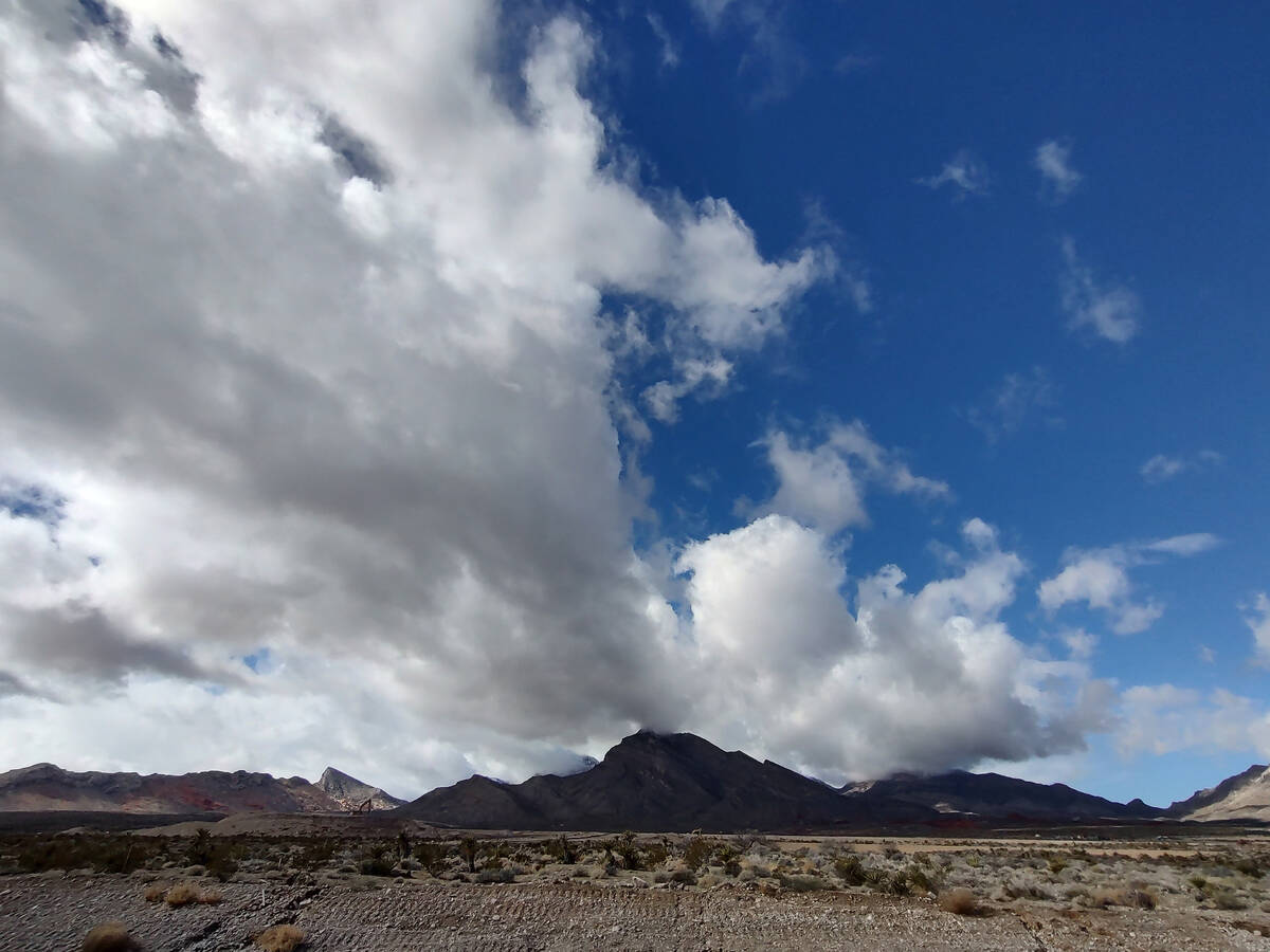 A cloud moves toward the Las Vegas Valley from the Spring Mountains west of Summerlin on Friday ...
