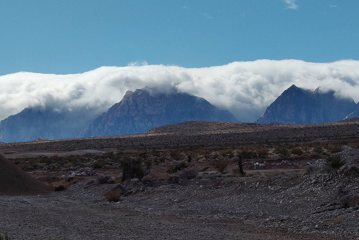 Heavy clouds fill in the valleys of the Spring Mountains west of Summerlin on Friday, Feb. 2, 2 ...