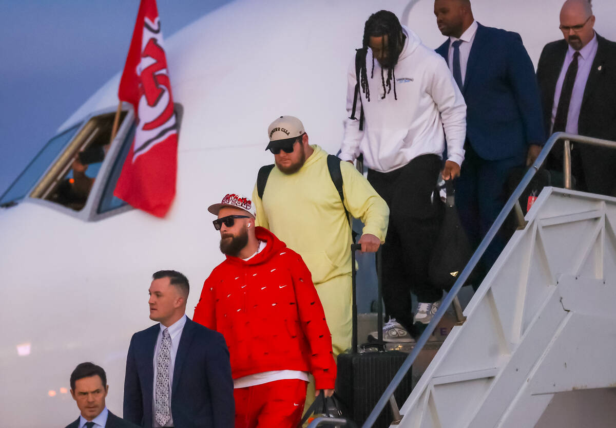 Kansas City Chiefs tight end Travis Kelce arrives at the Harry Reid International Airport along ...