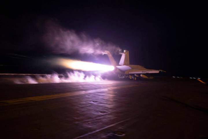 FILE - This image provided by the U.S. Navy shows an aircraft launching from USS Dwight D. Eise ...